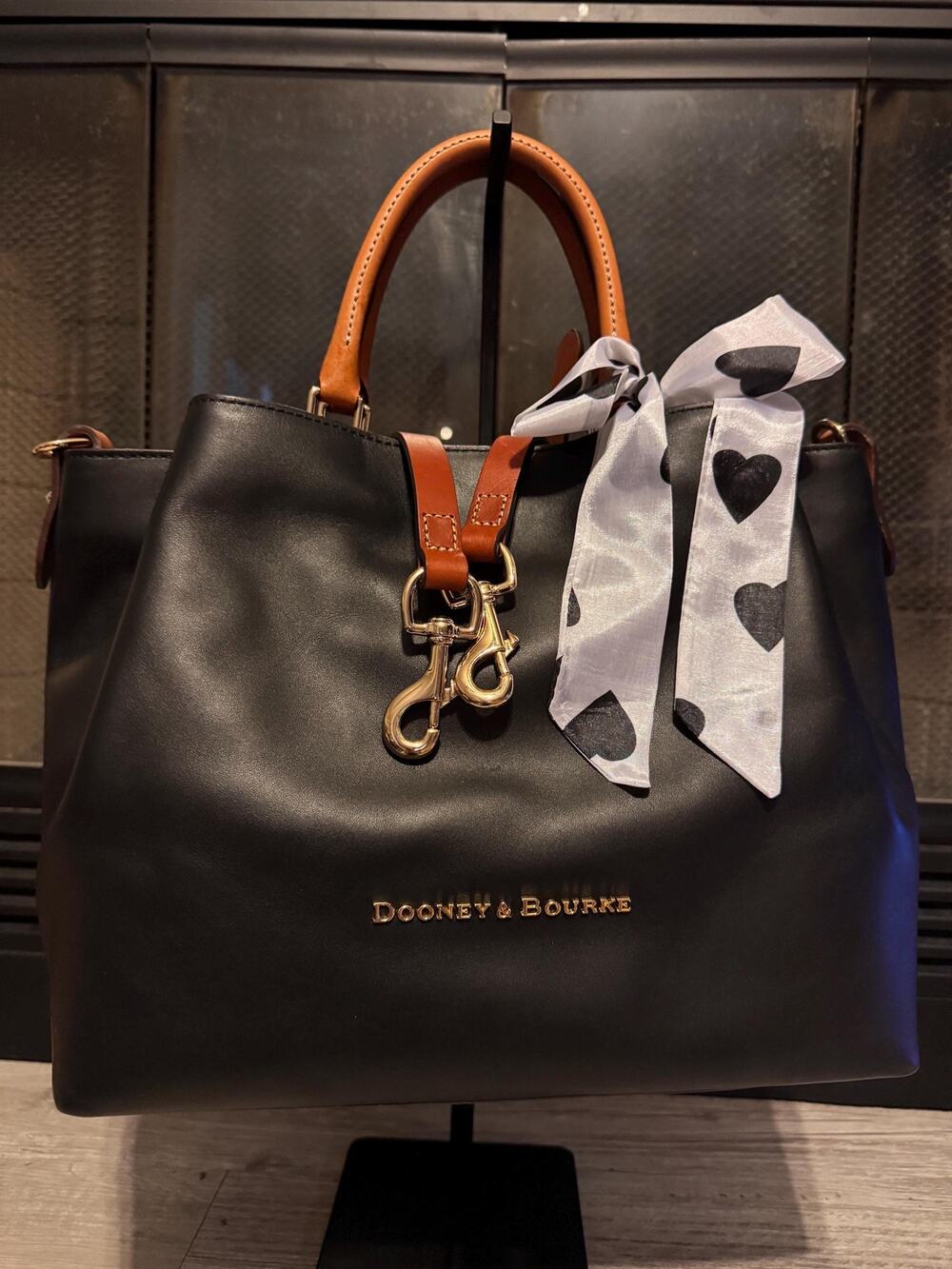 Black Florentine Dooney and Bourke Barlow with British tan handles and strap